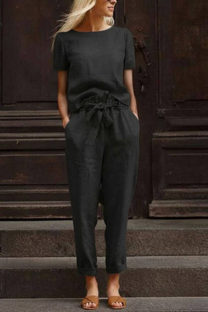 Black cotton linen set with relaxed short-sleeve top and straight-leg pants, breathable and lightweight fabric for casual wear