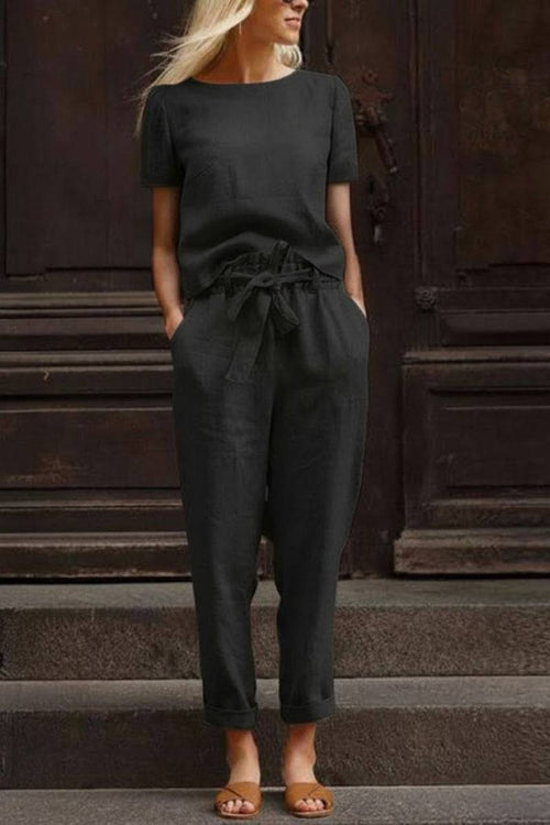 Black cotton linen set with relaxed short-sleeve top and straight-leg pants, breathable and lightweight fabric for casual wear