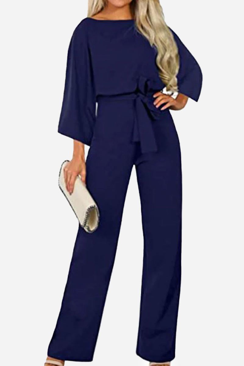 Navy blue casual long sleeve belted jumpsuit with batwing sleeves and round neck.