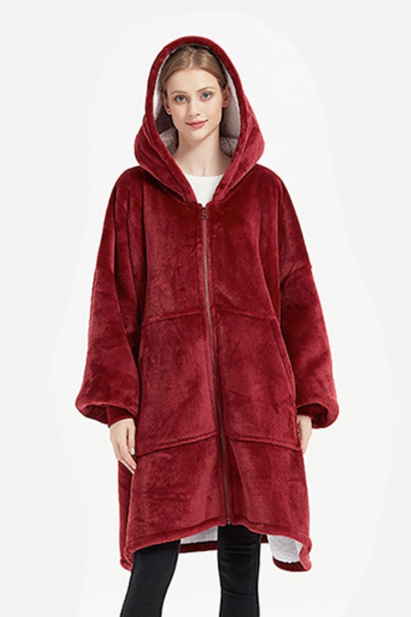 Oversized ultra soft hooded blanket in deep red with zipper and large front pockets, cozy and warm flannel sherpa material.