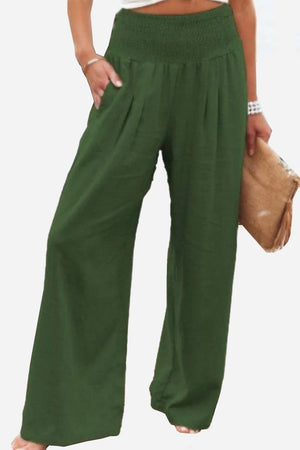 Women wearing green high-waist cotton linen palazzo pants with wide legs and pockets