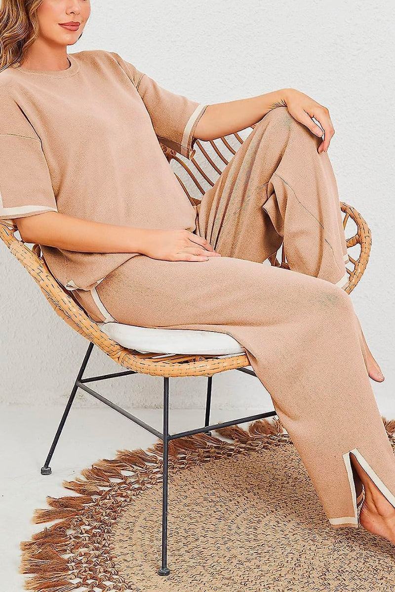 Woman wearing beige short sleeved relaxed fit lounge two-piece set sitting on a wicker chair
