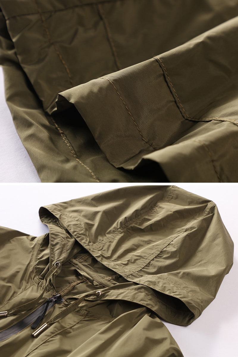 olive green travel ready outdoor raincoat windbreaker with hood and zipper close-up