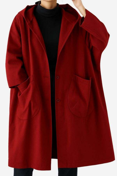 Oversized water-resistant red windbreaker jacket with waterproof design and front pockets