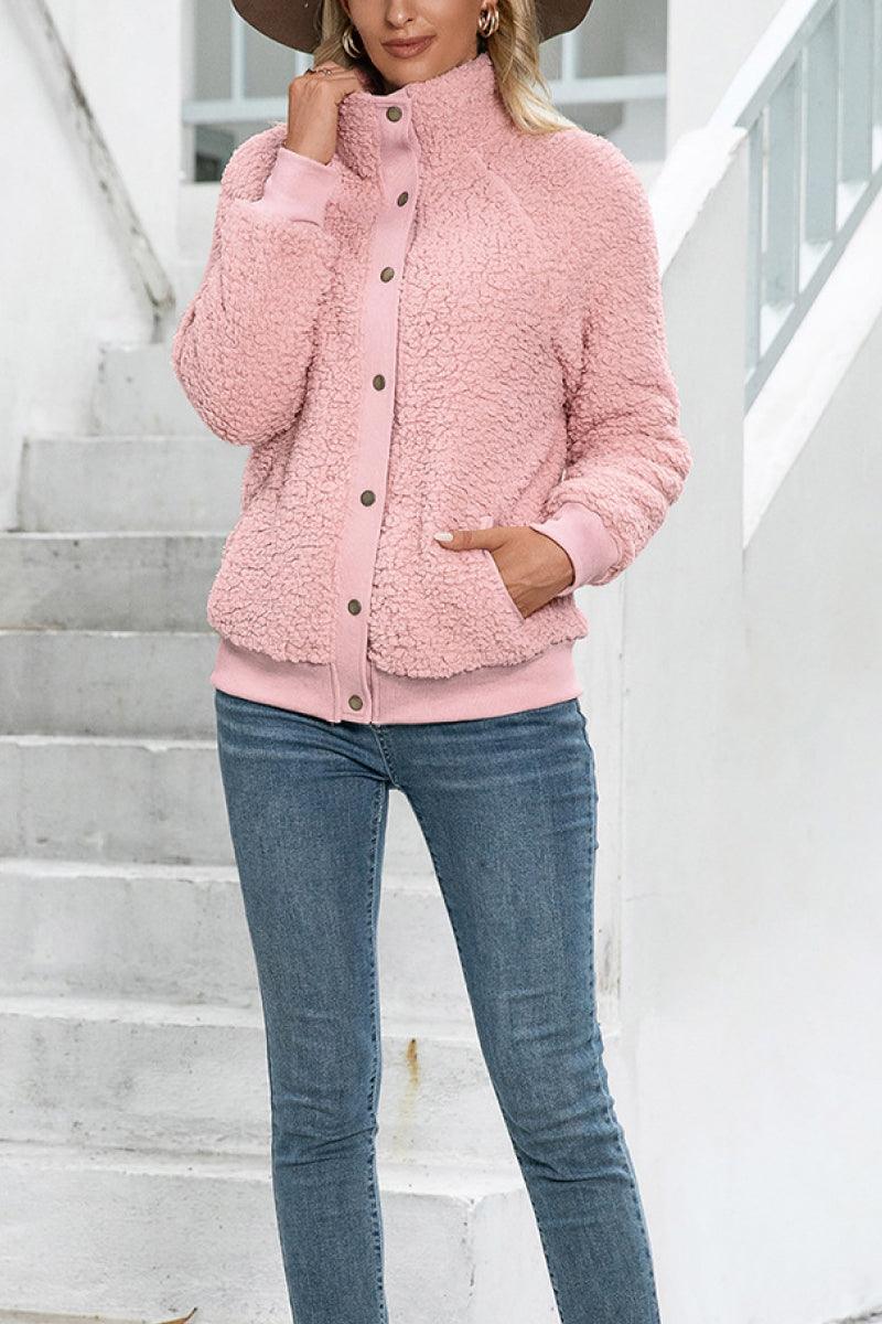 Cozy long sleeve pink sherpa jacket with button closure and fleece lining for warmth and comfort