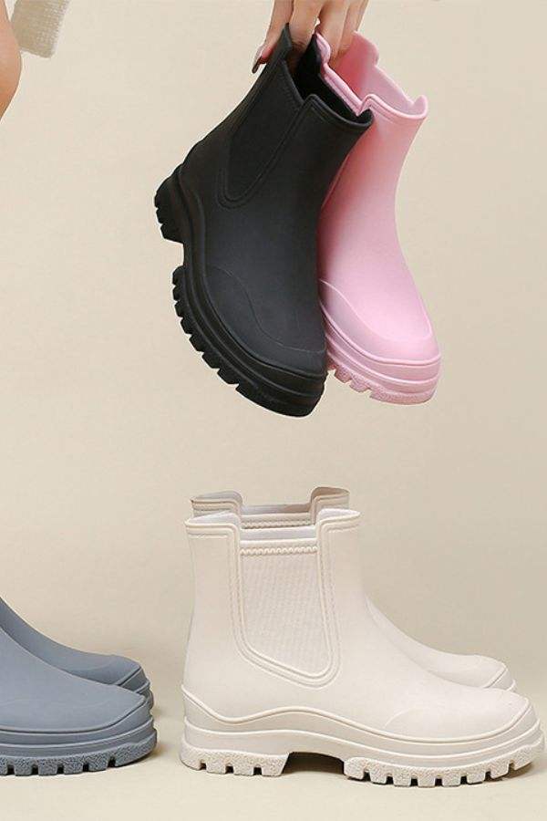 Black, pink, white, and gray non-slip rain boots with thick SuperGrip soles and waterproof design