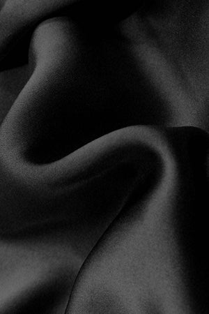 Black smooth mulberry silk fabric texture for luxurious pajama set
