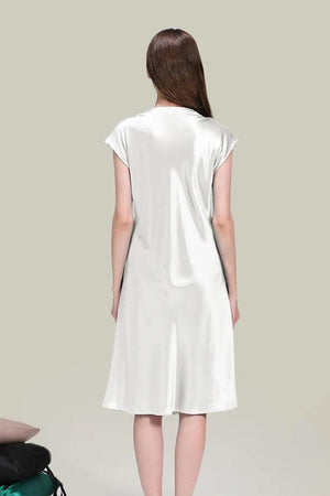 Back view of elegant white Mulberry Silk V-Neck Nightgown with short sleeves on model against gray background
