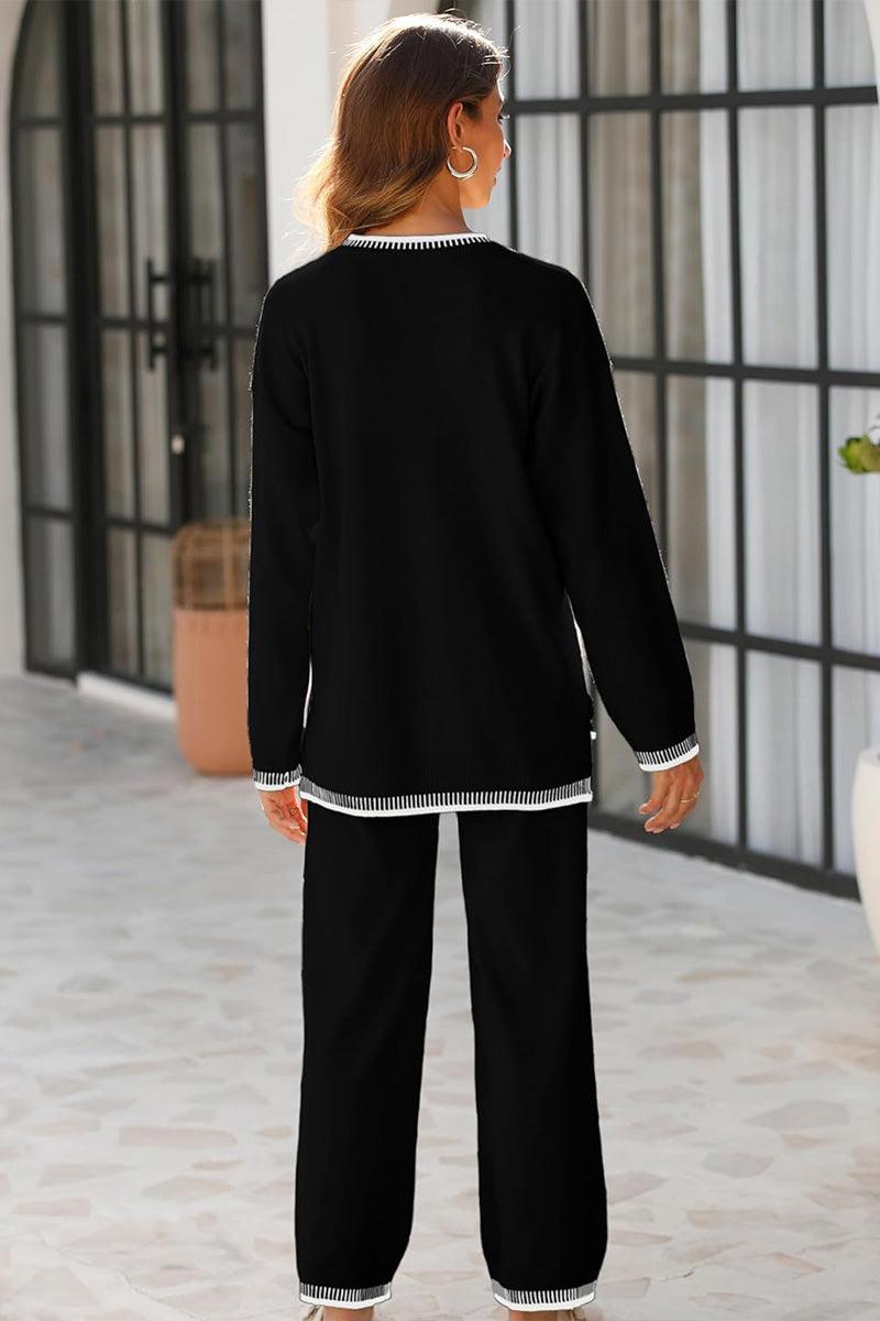 Woman wearing black Chic Contrast Stitch travel set with white contrast stitching, standing indoors facing away.