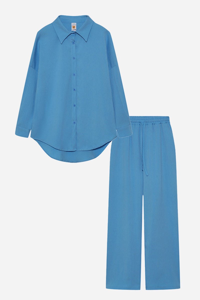Blue professional two-piece set with button-up shirt and drawstring pants in wrinkle-resistant polyester fabric