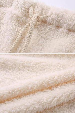 Close-up of soft cream sherpa fabric with braided drawstring from Cloud Soft 4-Piece Collection