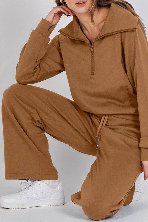 Brown Loungewear Buttersoft Tracksuit Set with oversized fit and zip-up top, styled with white sneakers