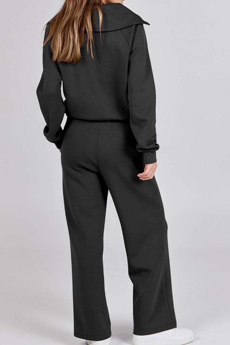 Woman wearing black Loungewear Buttersoft Tracksuit Set showing back view, cozy oversized fit.