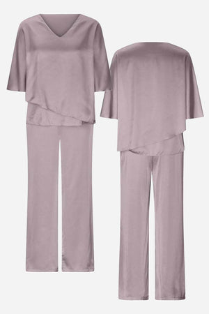 Elegant Layers Two-Piece Set with layered V-neck top and comfortable pants in soft, wrinkle-resistant fabric.