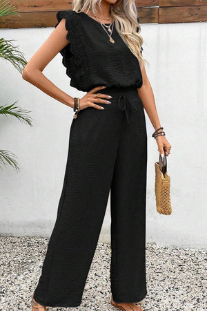 Elegant two-piece set in black with lace detail, soft fabric, and relaxed fit for comfortable stylish wear.