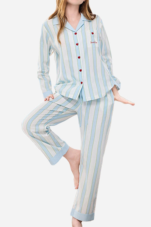 Woman wearing premium moisture-wicking cotton-tencel striped pajama set in light blue and white