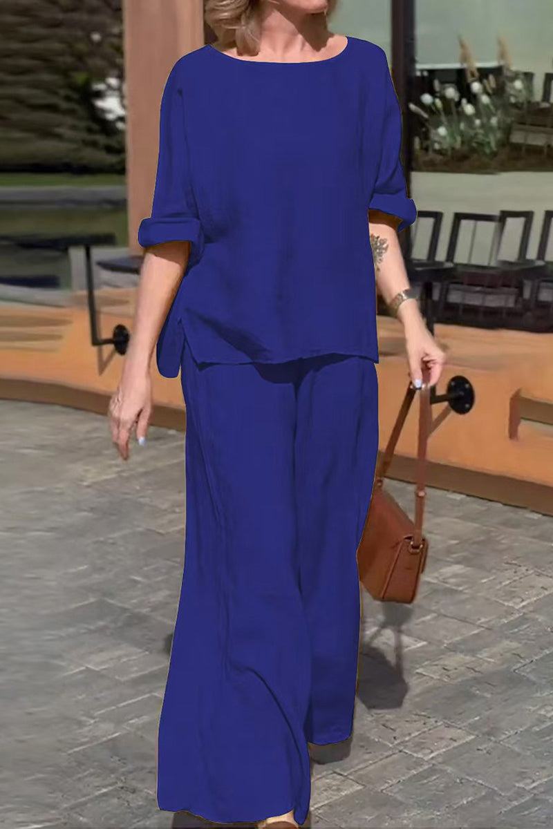 woman wearing royal blue 100% cotton two-piece set with round neck top and wide-leg pants outdoors