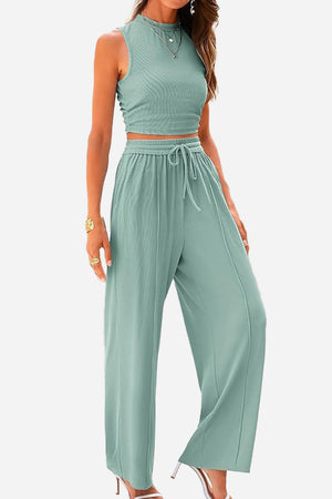 Woman wearing Stroll & Hangout Ribbed Knit sleeveless crop top and wide-leg pants set in sage green