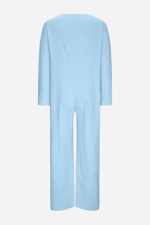 Light blue relaxed jumpsuit with long sleeves and wide legs, back view