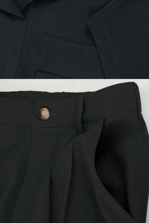 Black two-piece cargo set with big functional pockets and relaxed fit pants