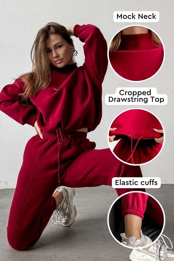 Woman wearing red Storm Sweater Mock Neck athleisure set with cropped drawstring top and elastic cuffs.