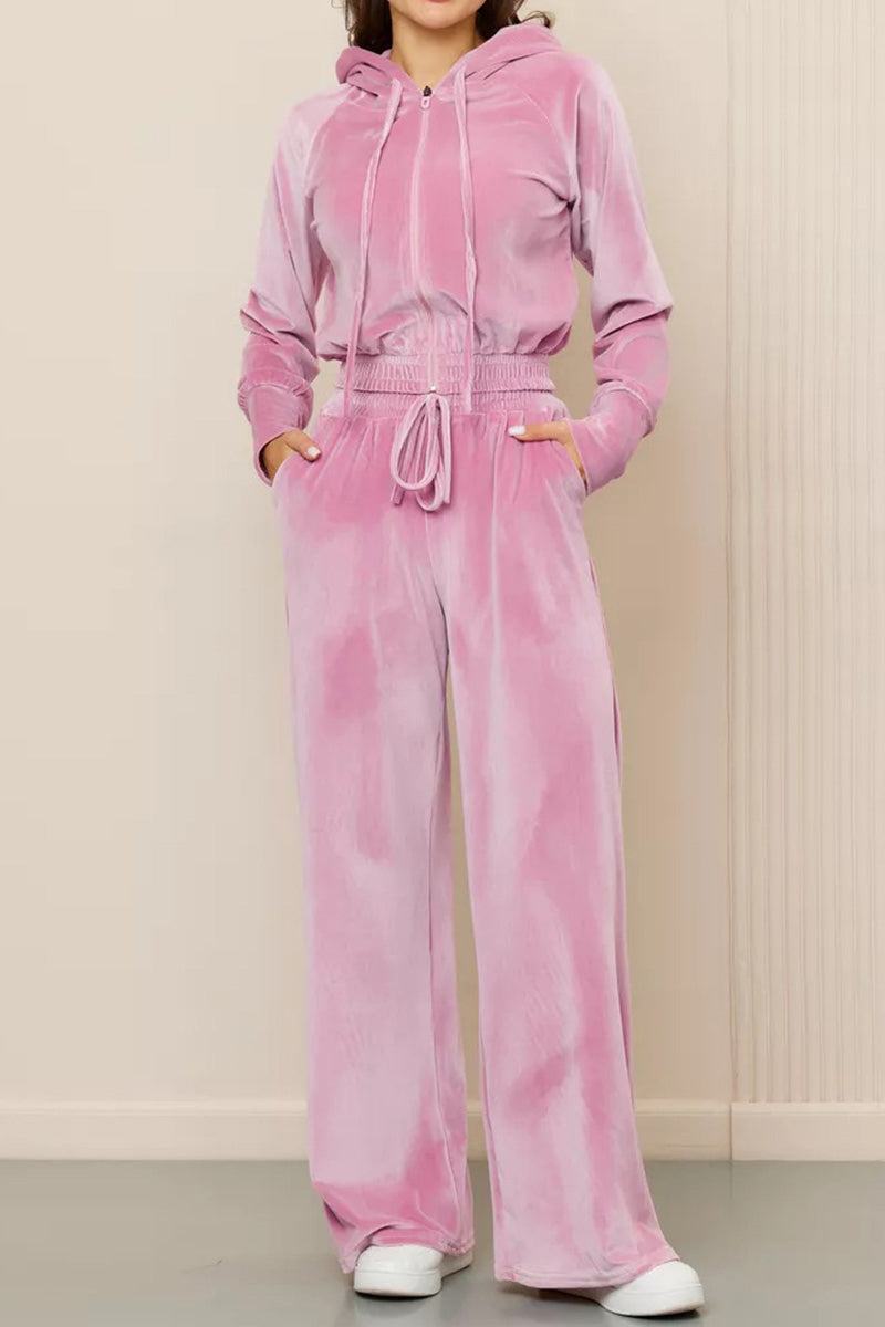 Pink velour tracksuit with cropped hoodie and high-waist drawstring pants, soft plush fabric for modern casual style