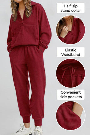 Unisex half-zip pullover and sweatpants set in red with stand collar, elastic waistband, and side pockets for casual comfort
