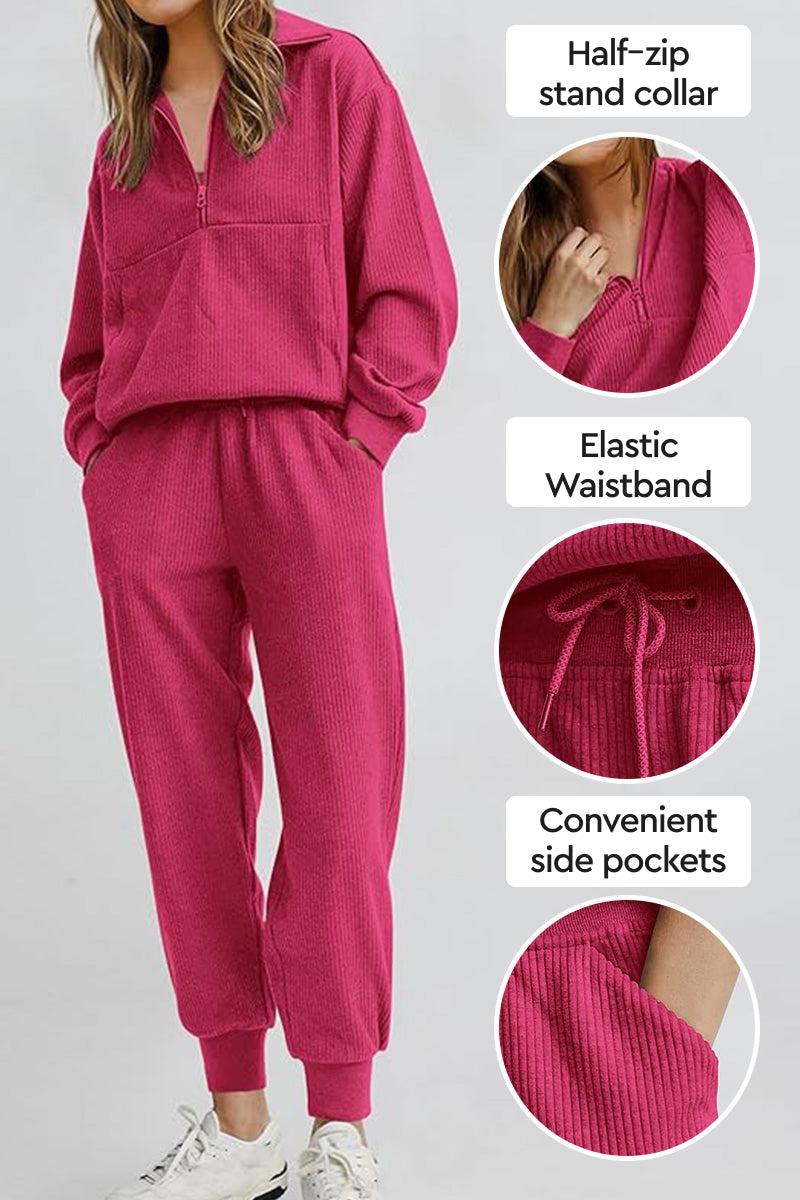 Unisex half-zip pullover and sweatpants set in pink with stand collar, elastic waistband, and side pockets.