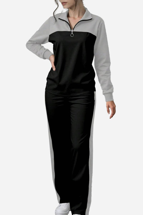 Woman wearing black and gray Colorblock Comfort Leisure Set with half-zip top and wide-leg pants