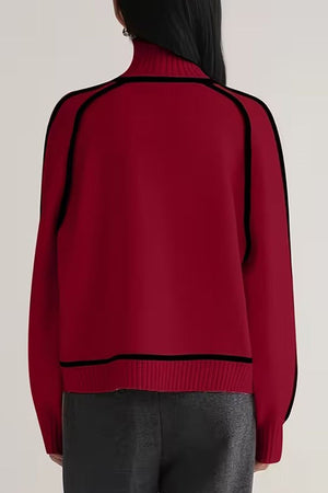 Back view of red Zero Itch Turtleneck Sweater with black contrast trim and relaxed fit on model
