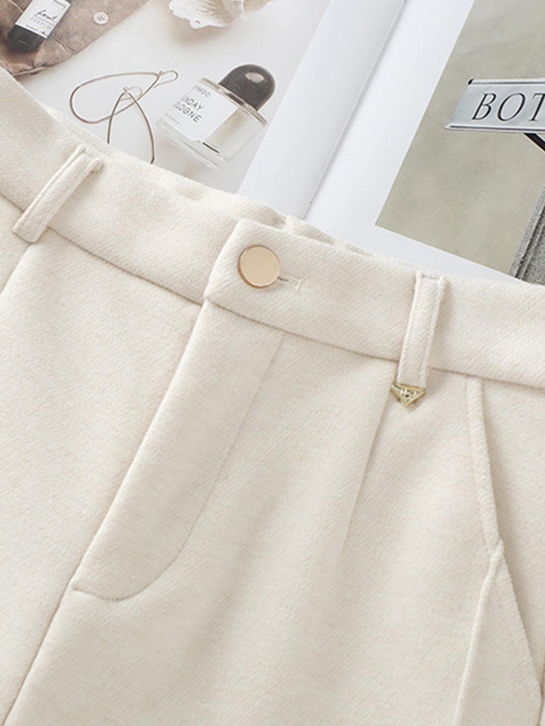 close-up of cream thermal wool blend trousers with button and belt loops for comfortable wide-leg winter wear