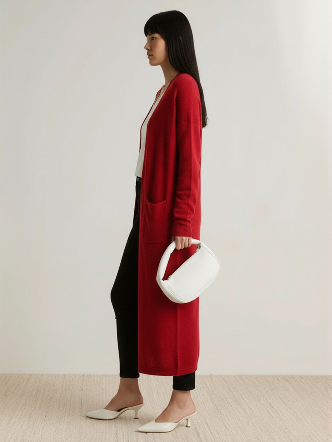 Long Australian Merino Wool cardigan with open front, patch pockets, ribbed cuffs, and natural temperature regulation for fall and winter layering.