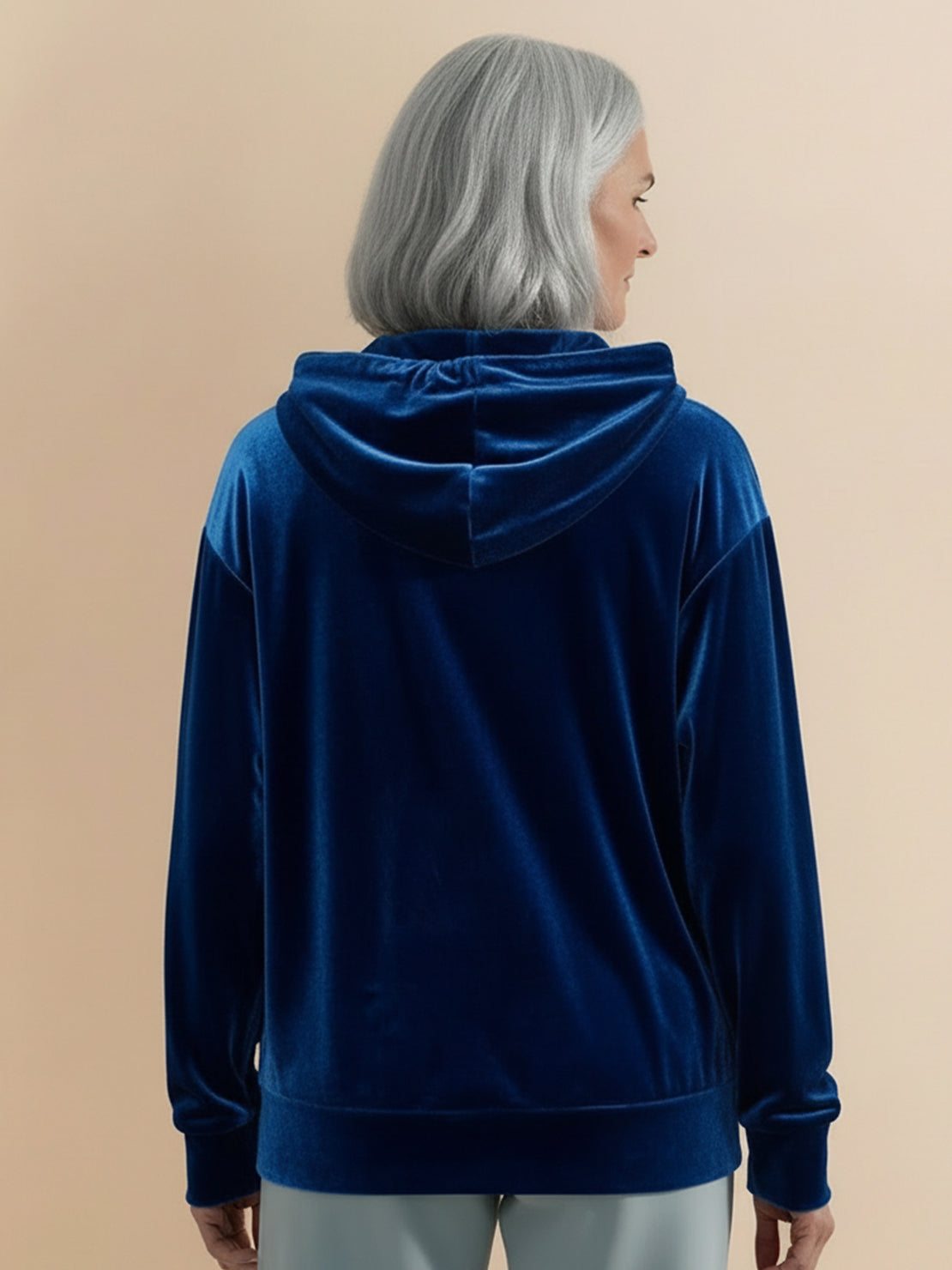 Ultra-soft velvet half-zip hoodie with hood and kangaroo pocket, plush texture and relaxed fit