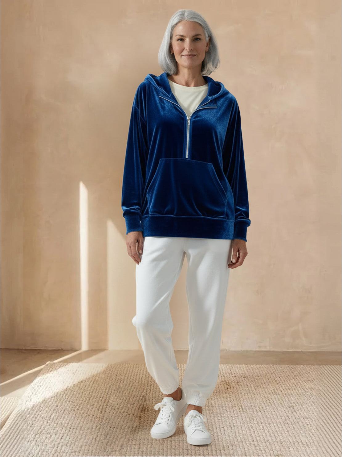 Ultra-soft velvet half-zip hoodie with kangaroo pocket and relaxed fit for year-round comfort