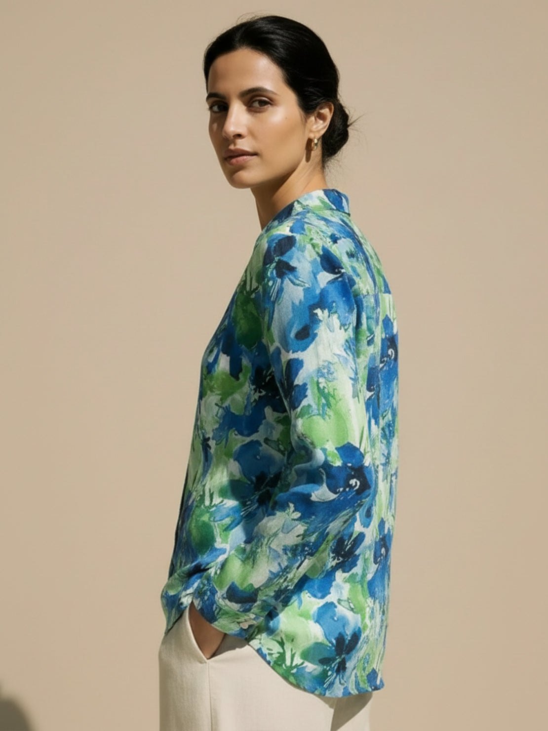 women's floral button-down shirt with long roll-up sleeves and hip-length hem