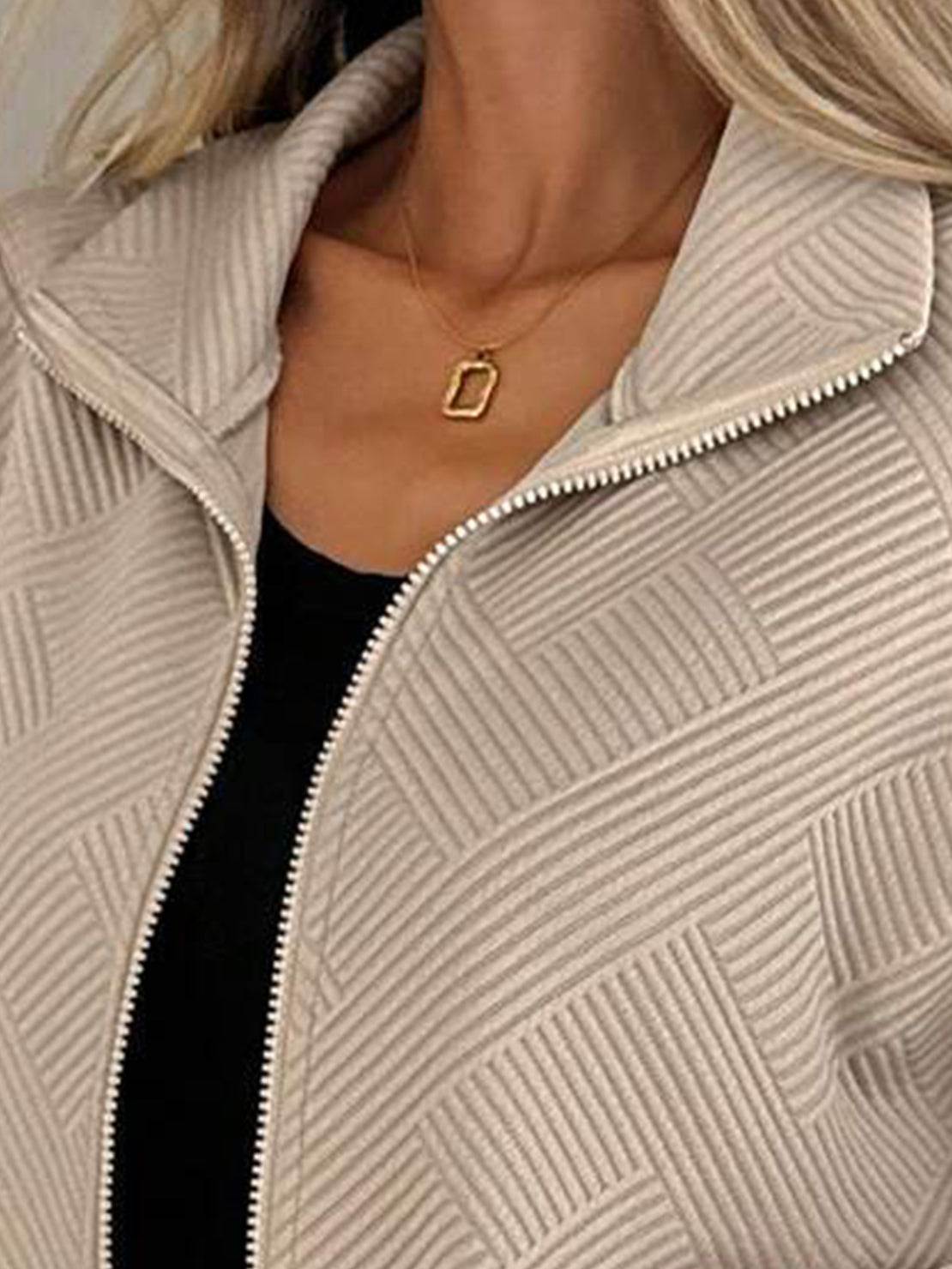 Textured cropped baseball jacket with full-zip, stand collar, and elastic cuffs and waistband.