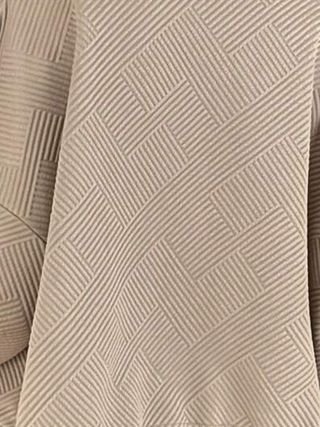 Cropped textured baseball jacket with full zipper, stand collar, elastic cuffs, and waistband.