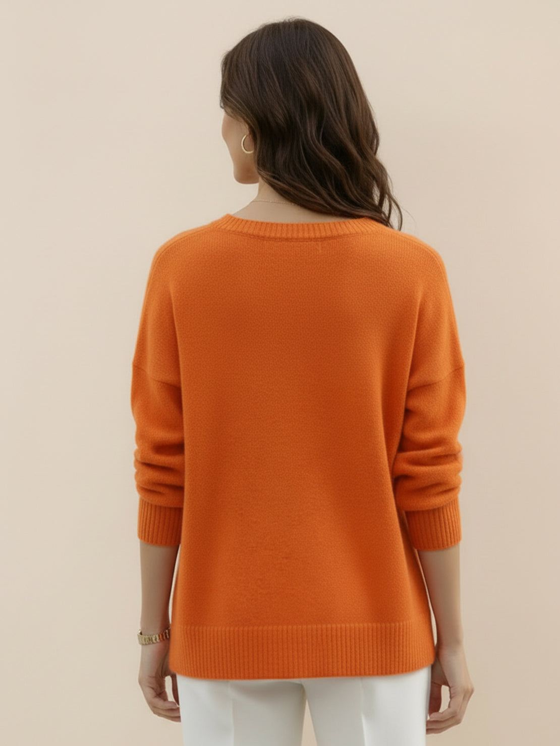 Oversized crew neck knit sweater with dropped shoulders and ribbed cuffs