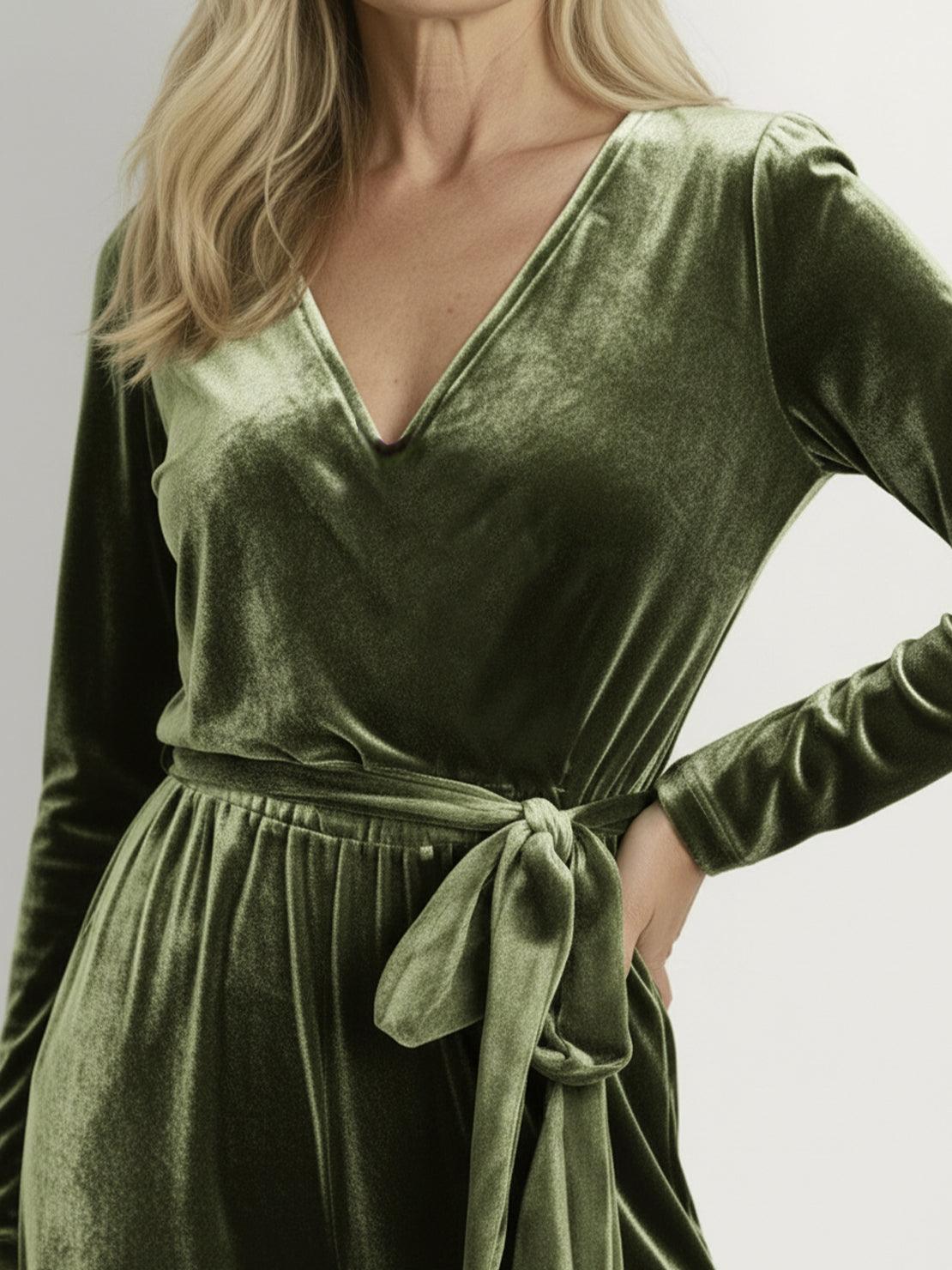 Woman wearing a deep V-neck velvet suit with long sleeves and wide-leg pants