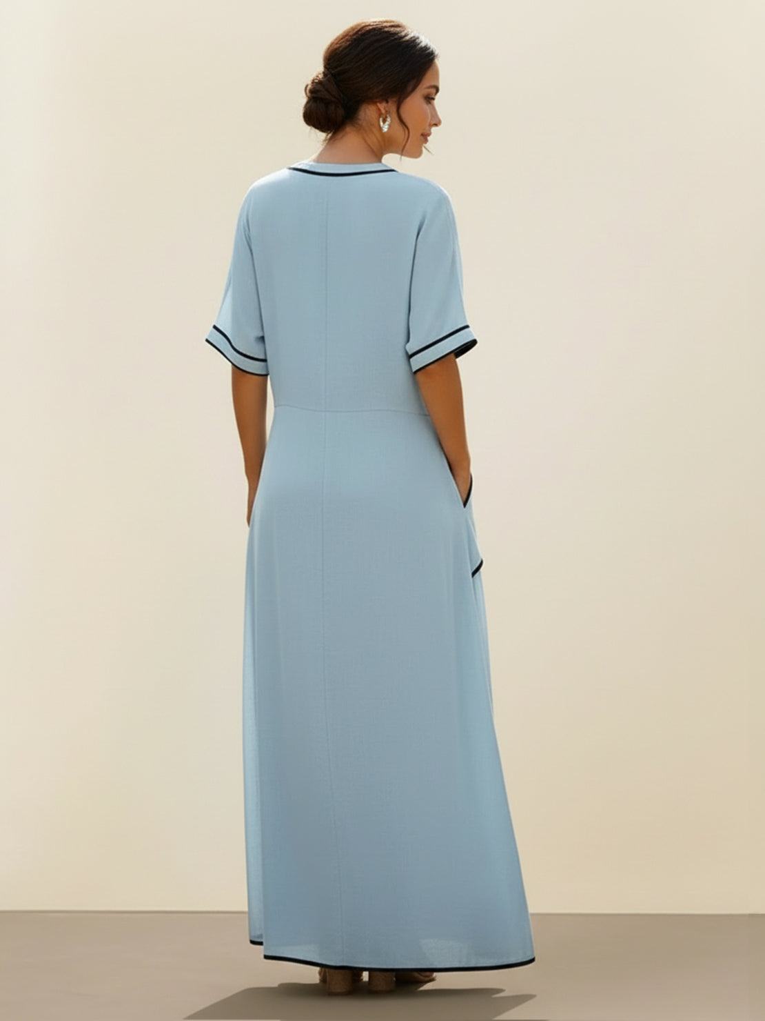 Knot-waist maxi dress with V-neckline, twist-knot waist, batwing sleeves, and flowing skirt with pockets