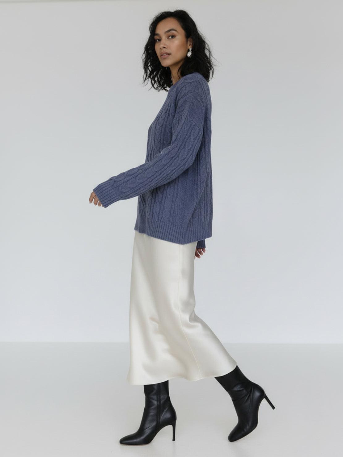 Oversized cable-knit crewneck sweater with dropped shoulders and diamond rope pattern