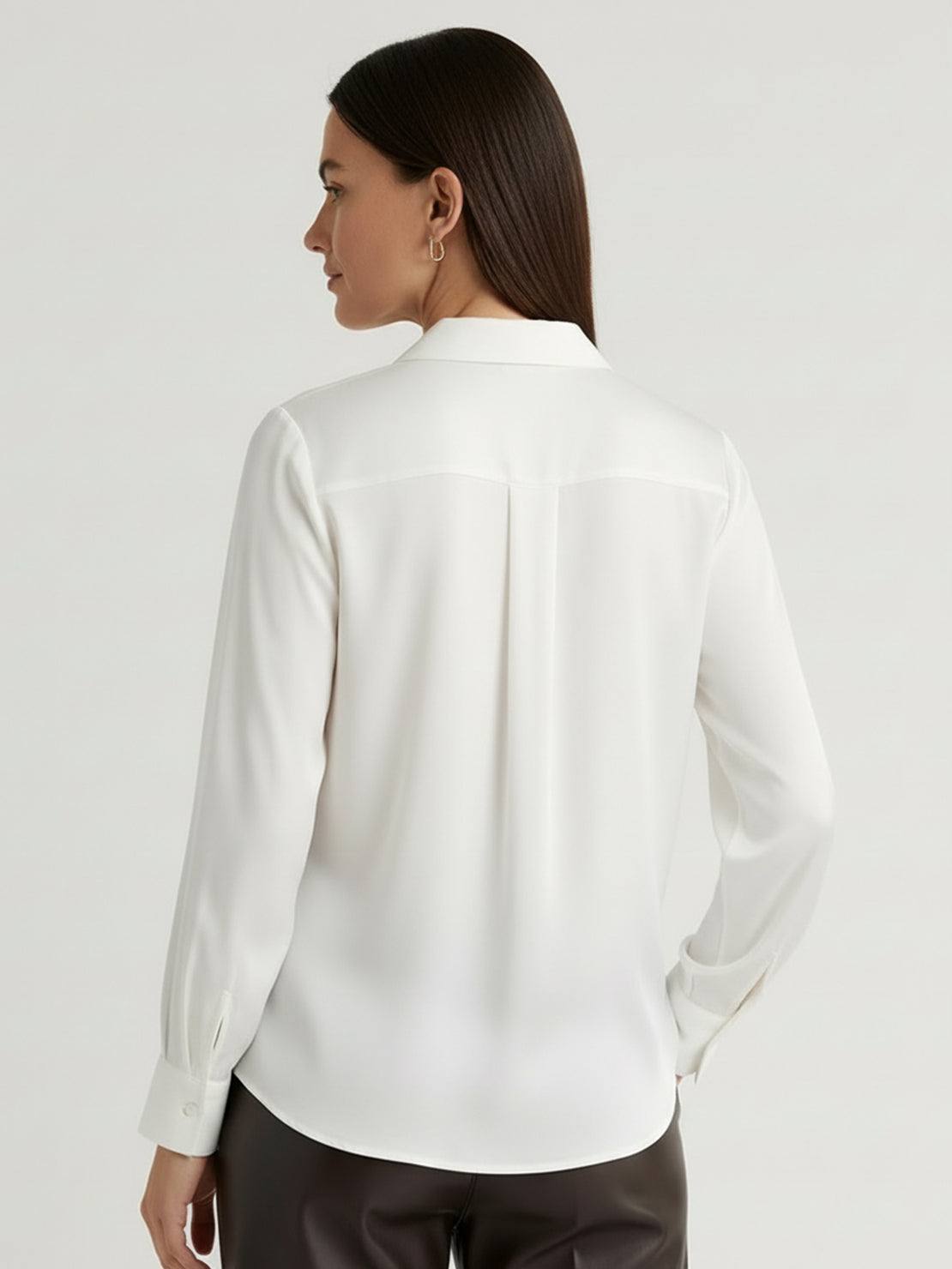 Silk-finish button front shirt with relaxed fit, traditional collar, and curved hem in smooth polyester fabric