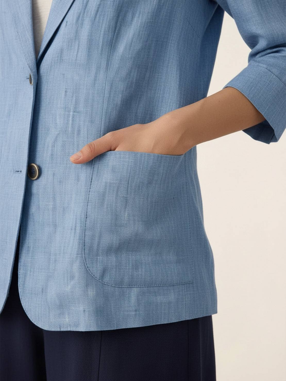 Cotton-linen blazer with notch lapels and two-button front in natural textured fabric.