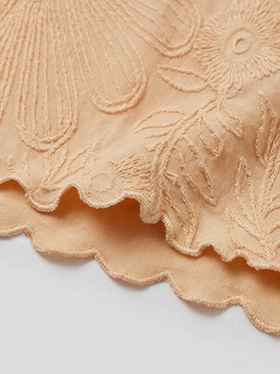 Lightweight floral jacquard pleated top with flutter sleeves and relaxed A-line fit