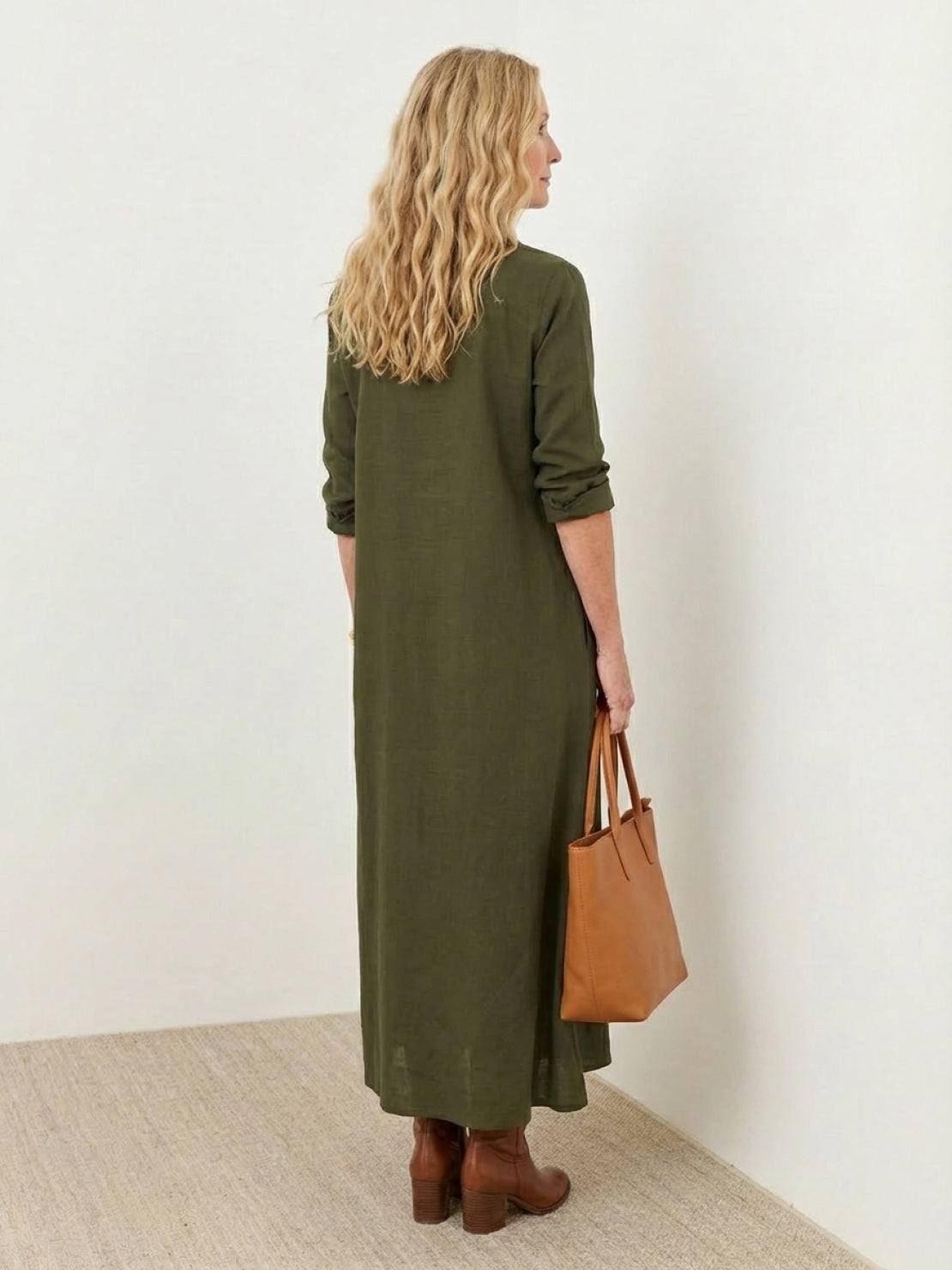 Wrinkle-free maxi button-down dress with point collar, chest pockets, long roll-up sleeves, and side slits for movement