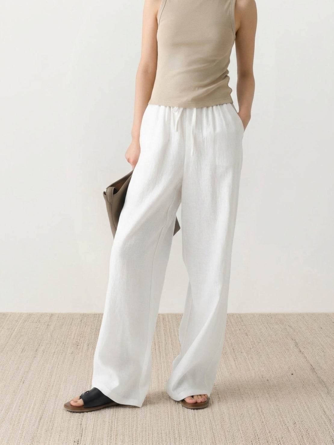 100% linen wide-leg pants with high-rise elastic waistband and side pockets