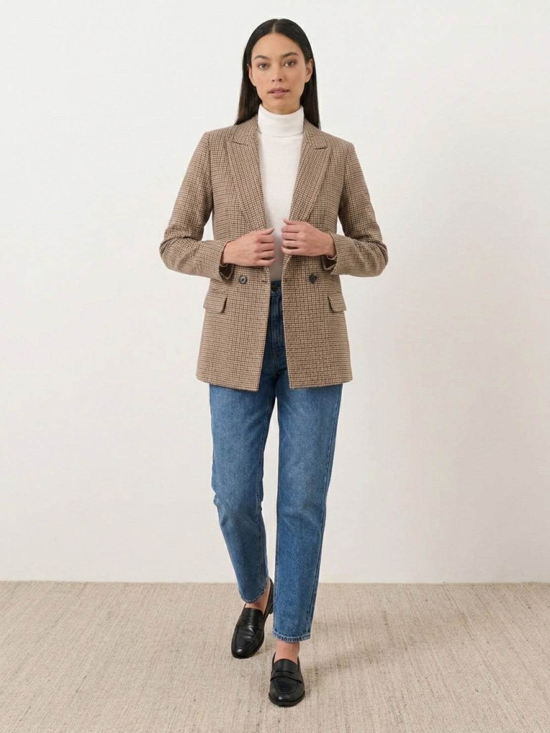 Black and white houndstooth commuter blazer with structured shoulders and relaxed fit