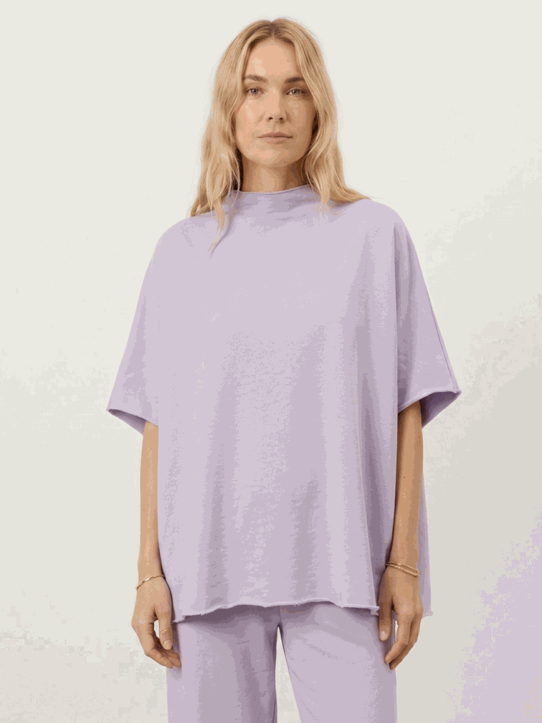 Cotton-blend capelet top with batwing sleeves paired with cropped wide-leg pants in relaxed fit lounge set