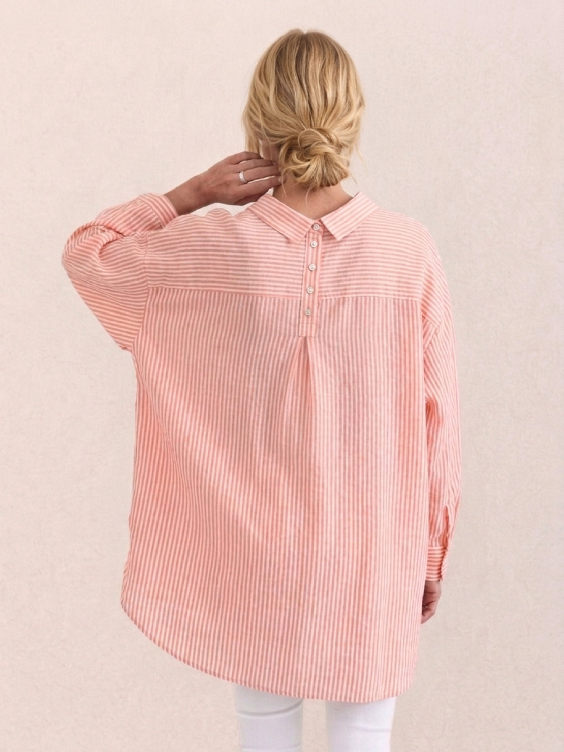 Peach oversized linen shirt with back pleat detail and relaxed fit