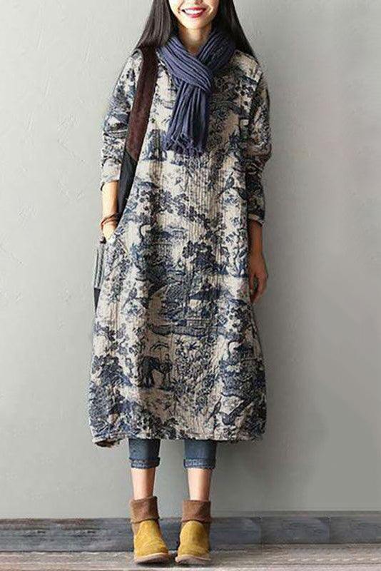 Woman wearing loose fit Japanese porcelain print midi dress with 3/4 sleeves and oversized pockets, styled with scarf and ankle boots